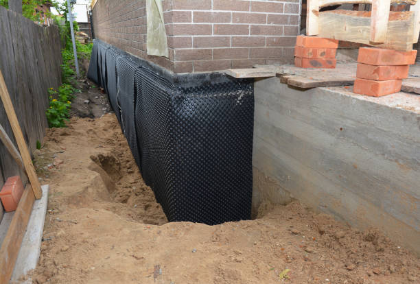 Happy homeowners after waterproofing job in Hillside